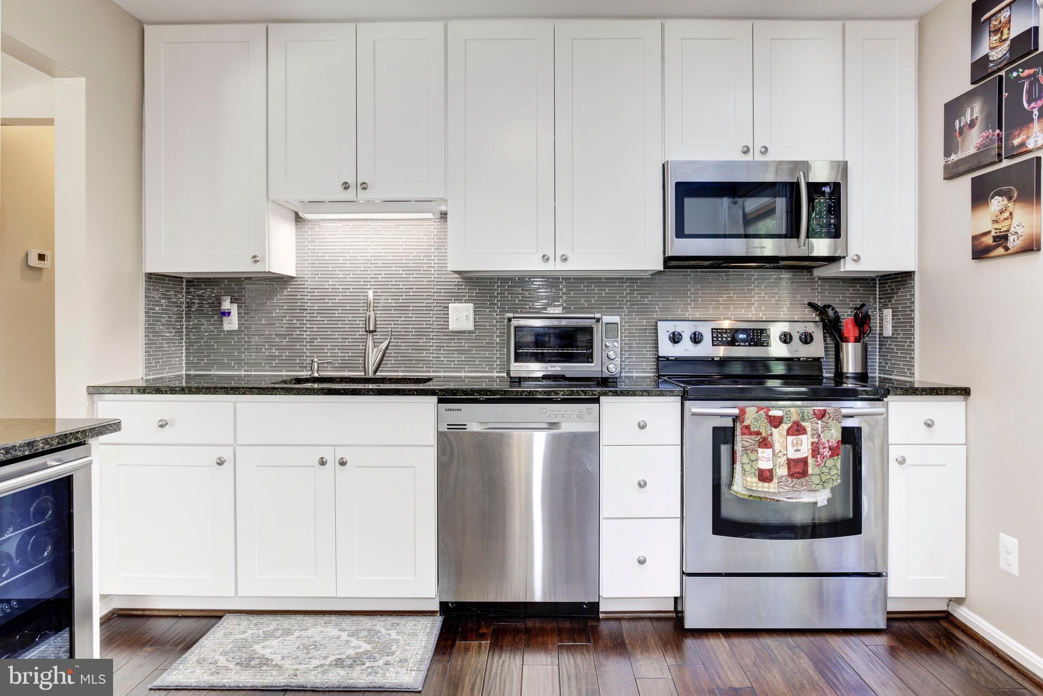 9010 Triple Ridge Road Fairfax Station, VA 22039 - Photo 16 of 59 Granite Countertops and Tiled Backsplash