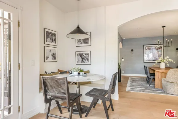 a kitchen with stainless steel appliances granite countertop a stove a sink and a wooden floors