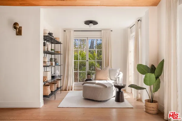 a living room with furniture a window and a fireplace