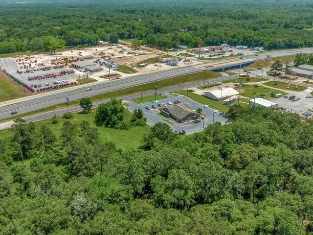 a view of a swimming pool with a yard and lake view