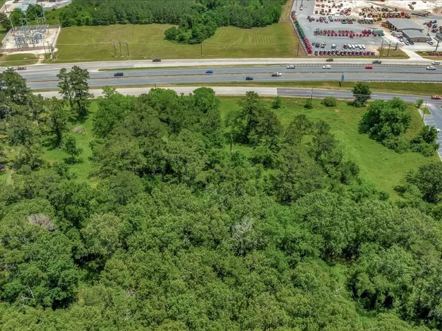 a view of a yard with a large pool and a bench