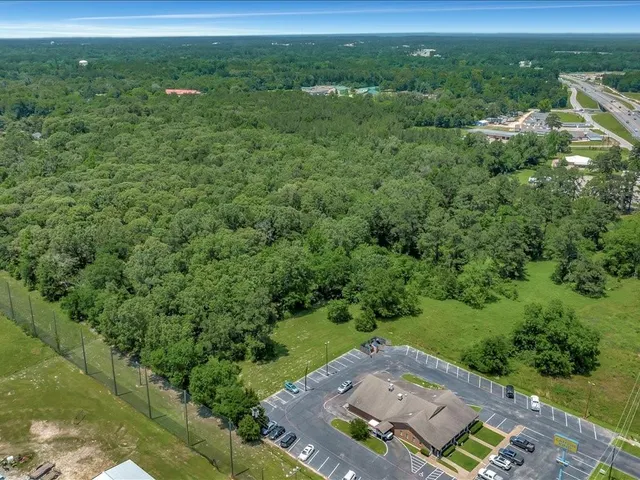 an aerial view of a house with outdoor space