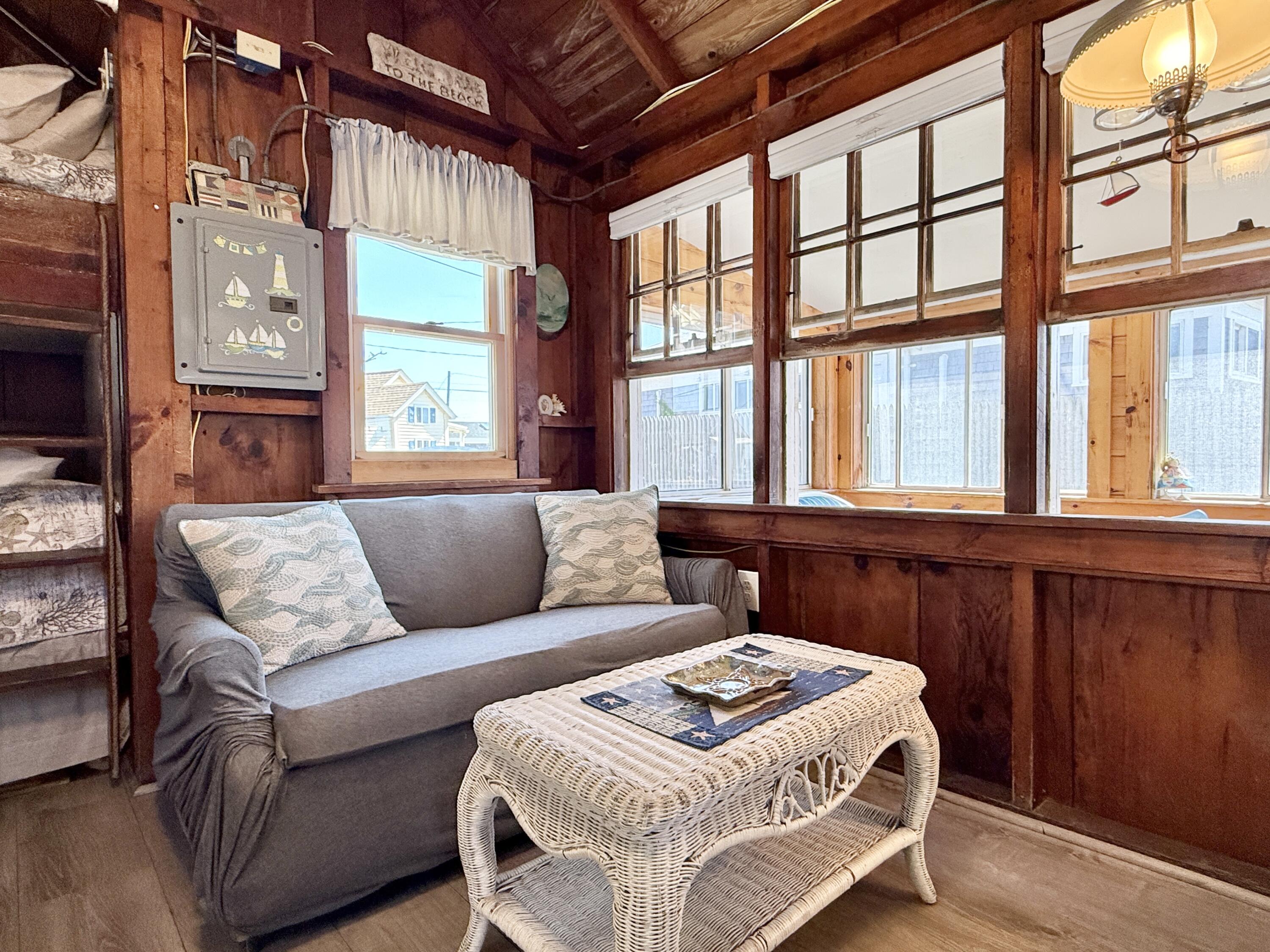 217 Old Wharf Road, Unit 64 Dennis Port, MA 02639 - Photo 14 of 25 a living room with furniture and a large window