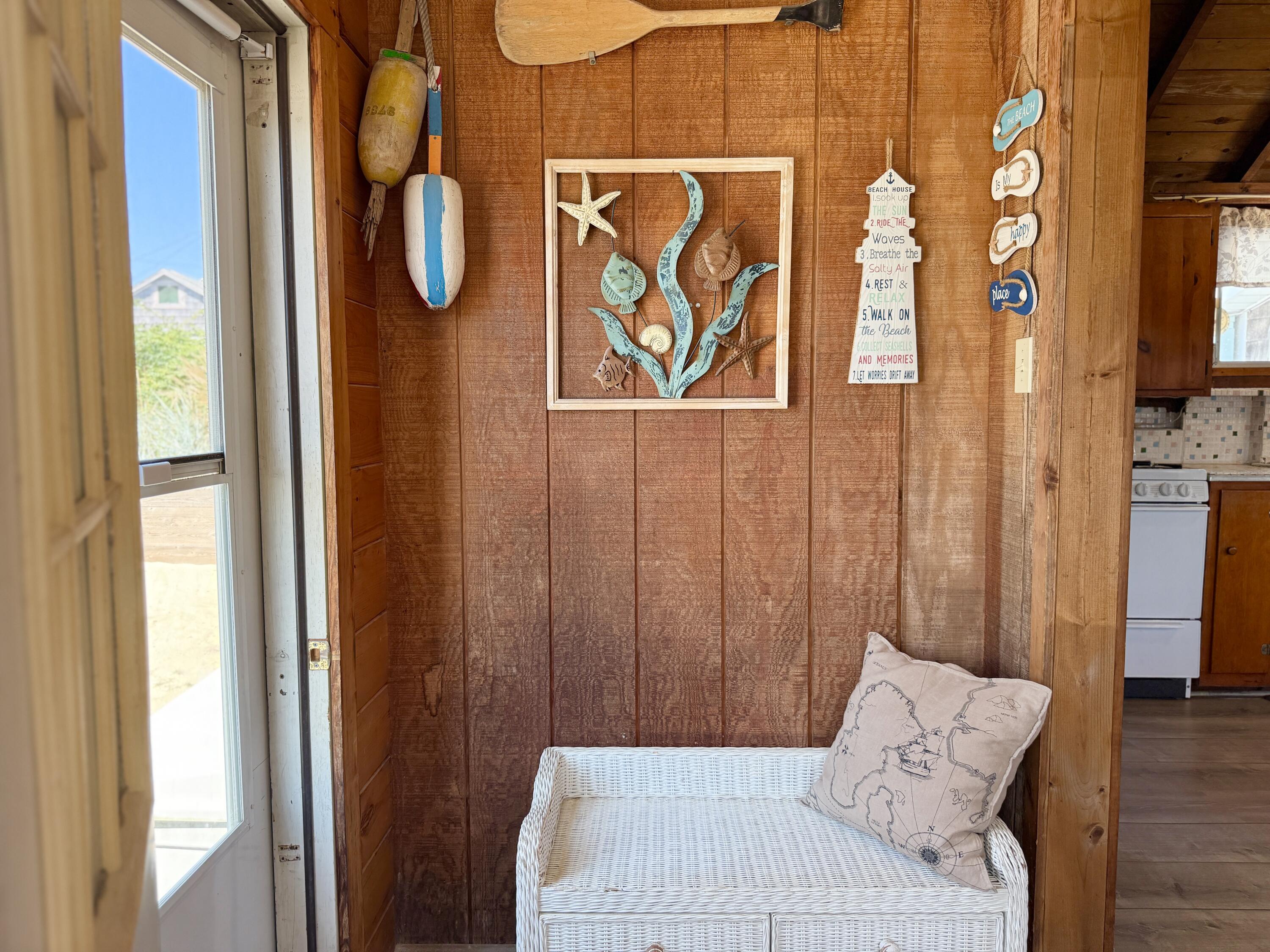 217 Old Wharf Road, Unit 64 Dennis Port, MA 02639 - Photo 6 of 25 a bedroom with a bed and a window with chair