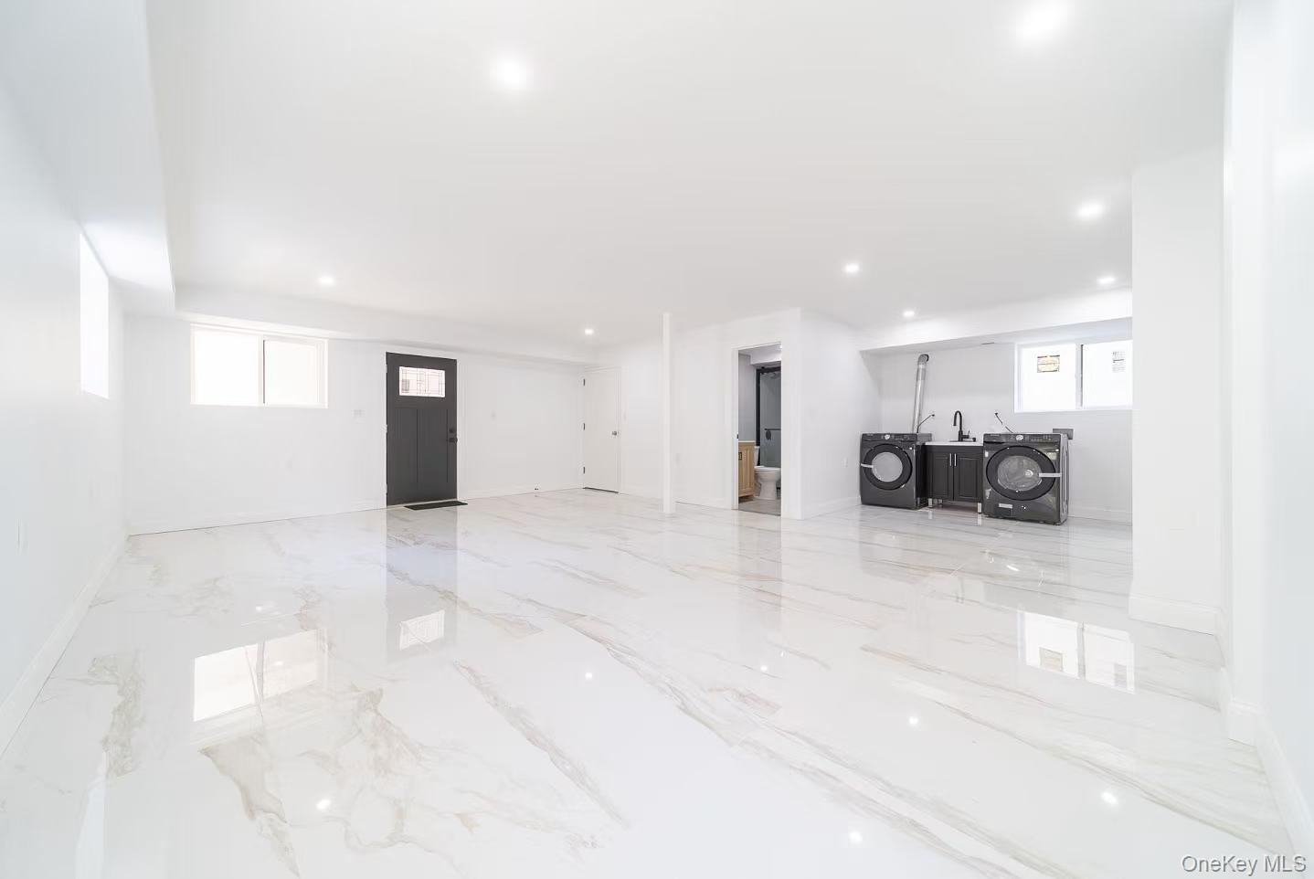 7-24 128th Street Queens, NY 11356 - Photo 19 of 31 Living area with light marble finish flooring and recessed lighting