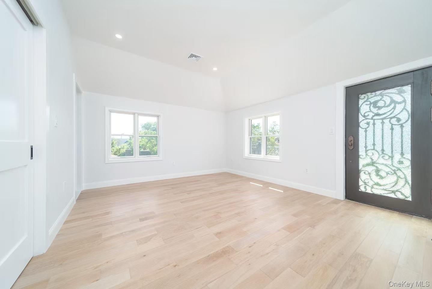 7-24 128th Street Queens, NY 11356 - Photo 20 of 31 Foyer entrance featuring light wood-style flooring, recessed lighting, and lofted ceiling