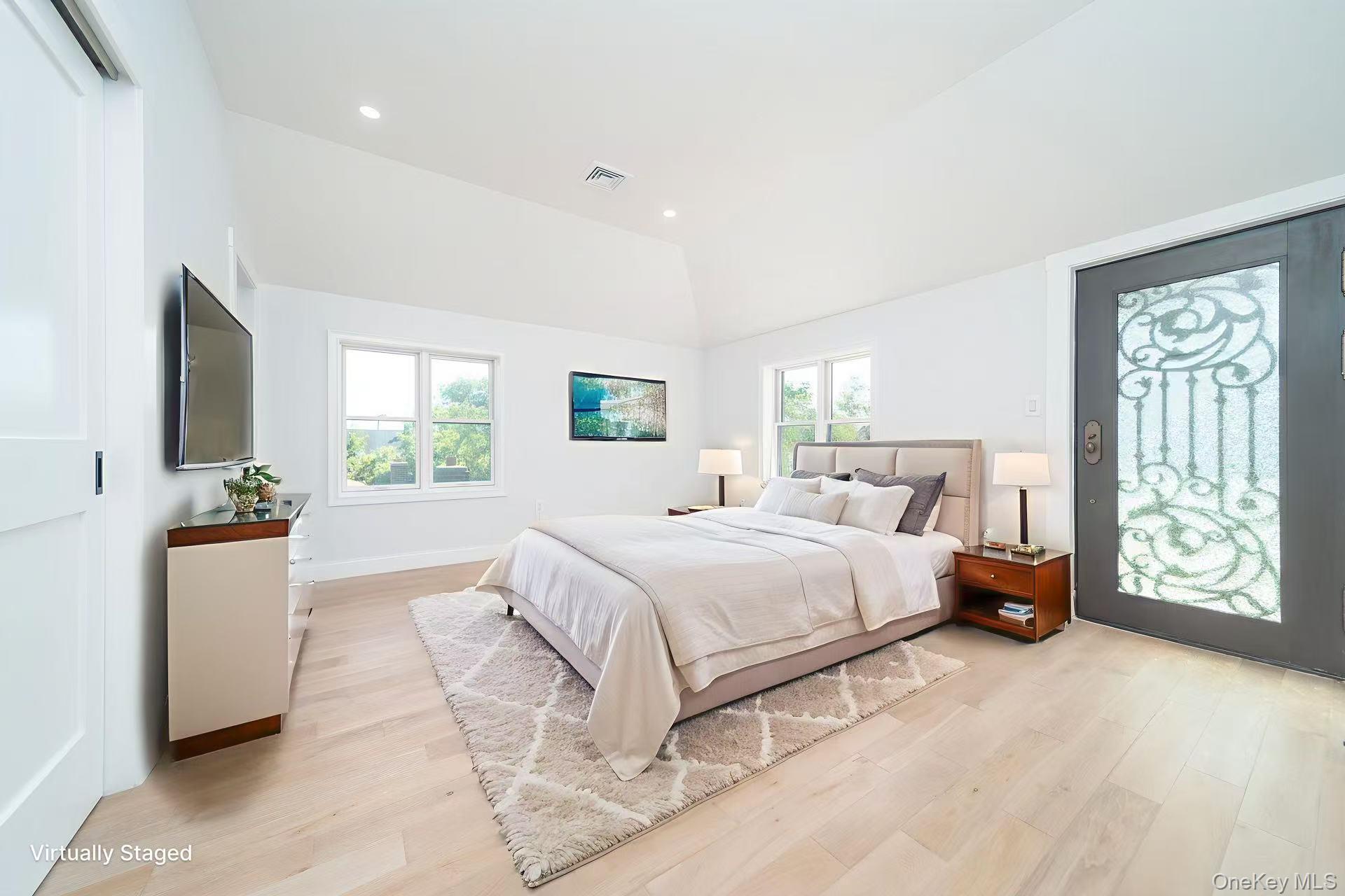 7-24 128th Street Queens, NY 11356 - Photo 8 of 31 Bedroom with light wood-style floors, access to outside, recessed lighting, and lofted ceiling