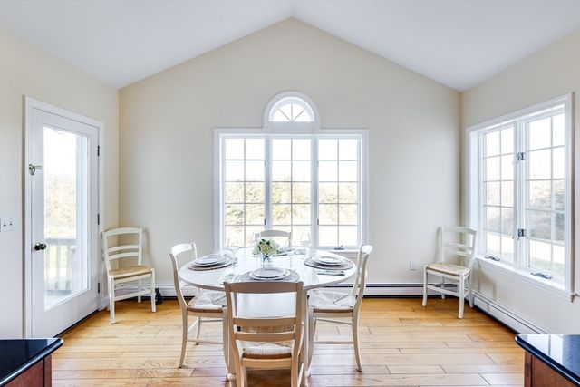 a view of a livingroom with furniture and a window