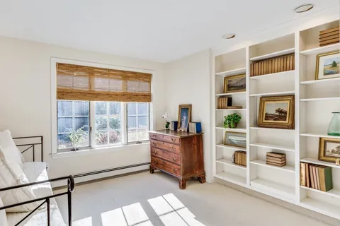 a room with furniture and a window