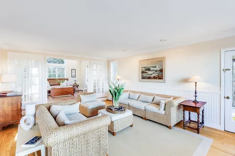 a living room with furniture and a table