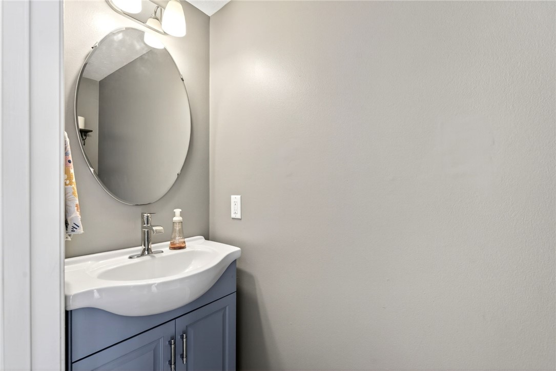 39 Holly Court Springboro, OH 45066 - Photo 16 of 42 This clean and bright powder room features a classic sink and vanity combination.