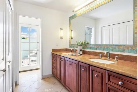 a bathroom with a granite countertop sink a mirror and a