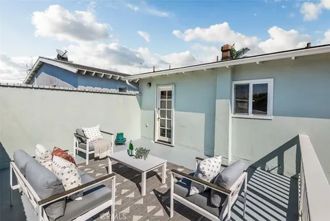 a view of a balcony with furniture