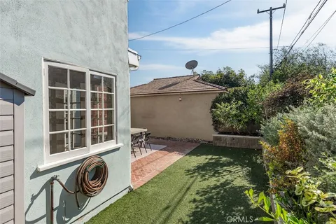 a view of a backyard with table and chairs