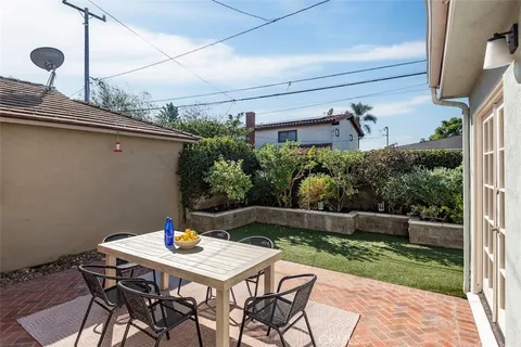 an aerial view of multiple houses with yard
