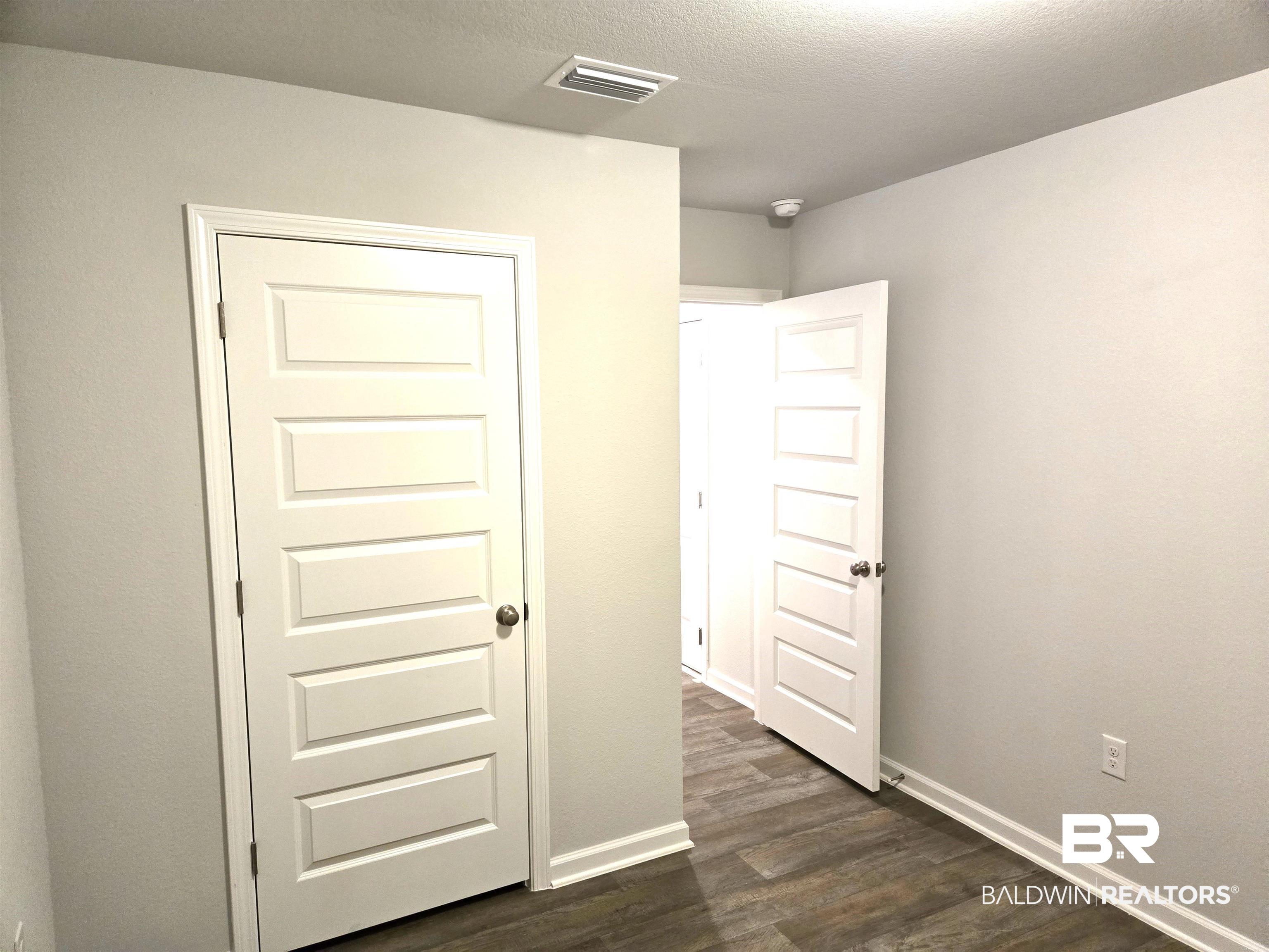 24227 Veranda Circle Elberta, AL 36530 - Photo 14 of 36 Interior space featuring dark hardwood / wood-style flooring