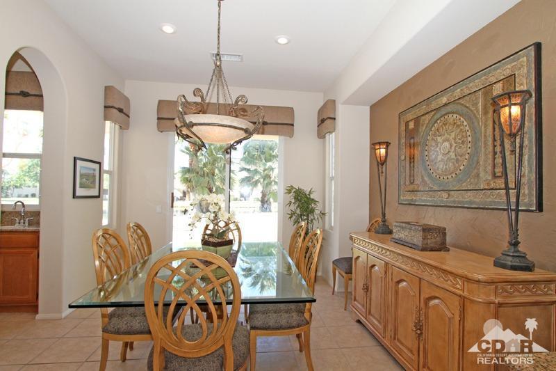 7 Wimbledon Circle Rancho Mirage, CA 92270 - Photo 14 of 46 a view of a dining room with furniture wooden floor and chandelier