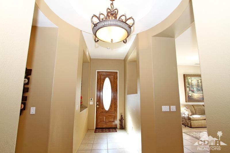 7 Wimbledon Circle Rancho Mirage, CA 92270 - Photo 18 of 46 a bathroom with a sink mirror and vanity