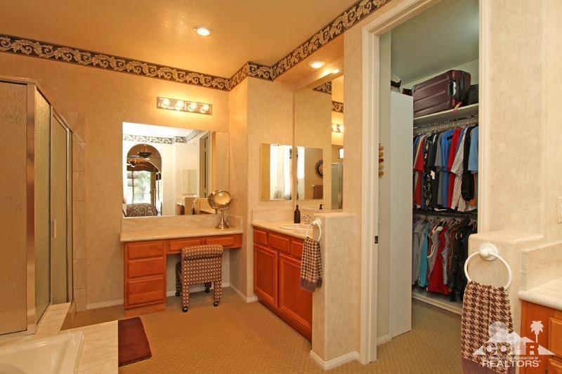 7 Wimbledon Circle Rancho Mirage, CA 92270 - Photo 23 of 46 a view of a bathroom with dual sinks