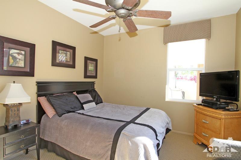 7 Wimbledon Circle Rancho Mirage, CA 92270 - Photo 26 of 46 a bedroom with a bed and a flat screen tv