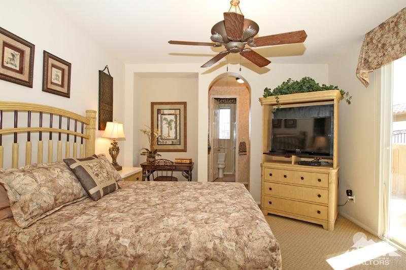 7 Wimbledon Circle Rancho Mirage, CA 92270 - Photo 29 of 46 a bedroom with a bed and furniture