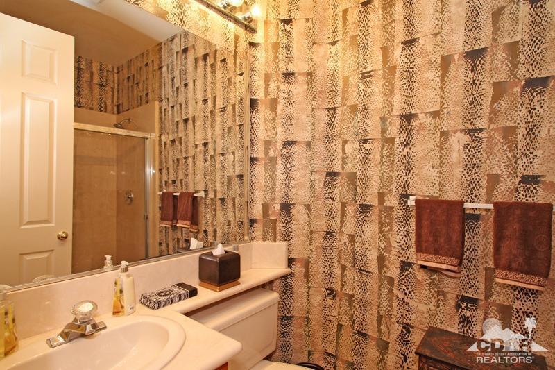 7 Wimbledon Circle Rancho Mirage, CA 92270 - Photo 31 of 46 a bathroom with a sink and a mirror