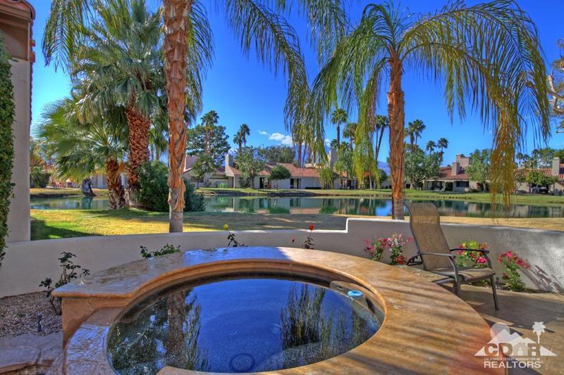7 Wimbledon Circle Rancho Mirage, CA 92270 - Photo 33 of 46 a view of swimming pool with a patio and a garden