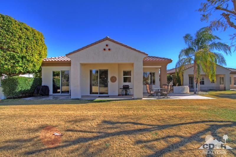 7 Wimbledon Circle Rancho Mirage, CA 92270 - Photo 36 of 46 a view of a house with swimming pool and a yard