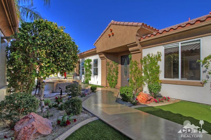 7 Wimbledon Circle Rancho Mirage, CA 92270 - Photo 40 of 46 front view of a house with a yard