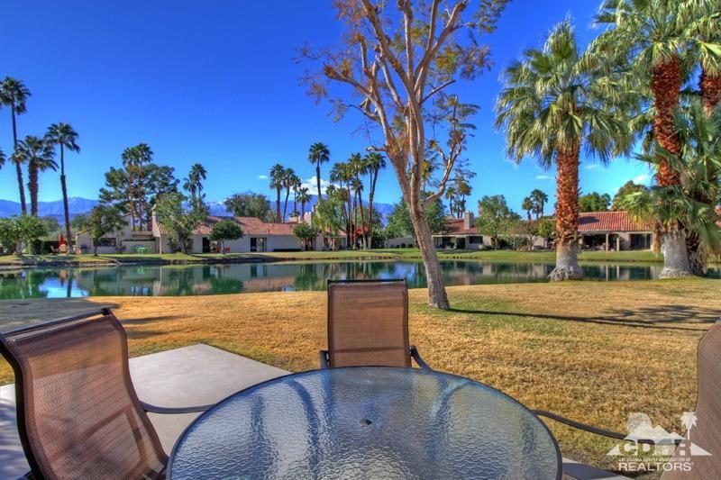 7 Wimbledon Circle Rancho Mirage, CA 92270 - Photo 42 of 46 a view of a swimming pool with a patio and a yard