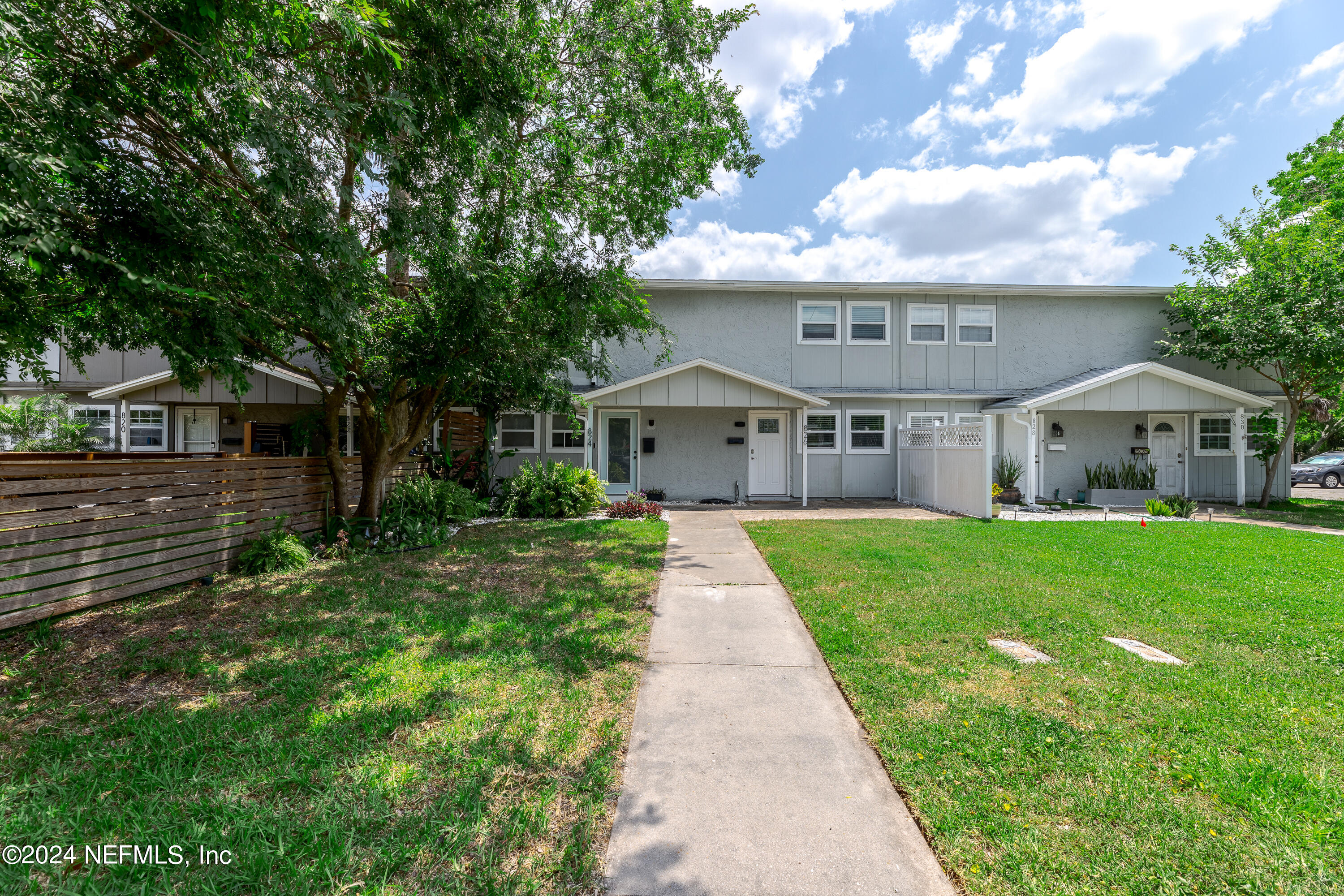 824 Cavalla Road Atlantic Beach, FL 32233 - Photo 1 of 18 a front view of a house with a yard and porch