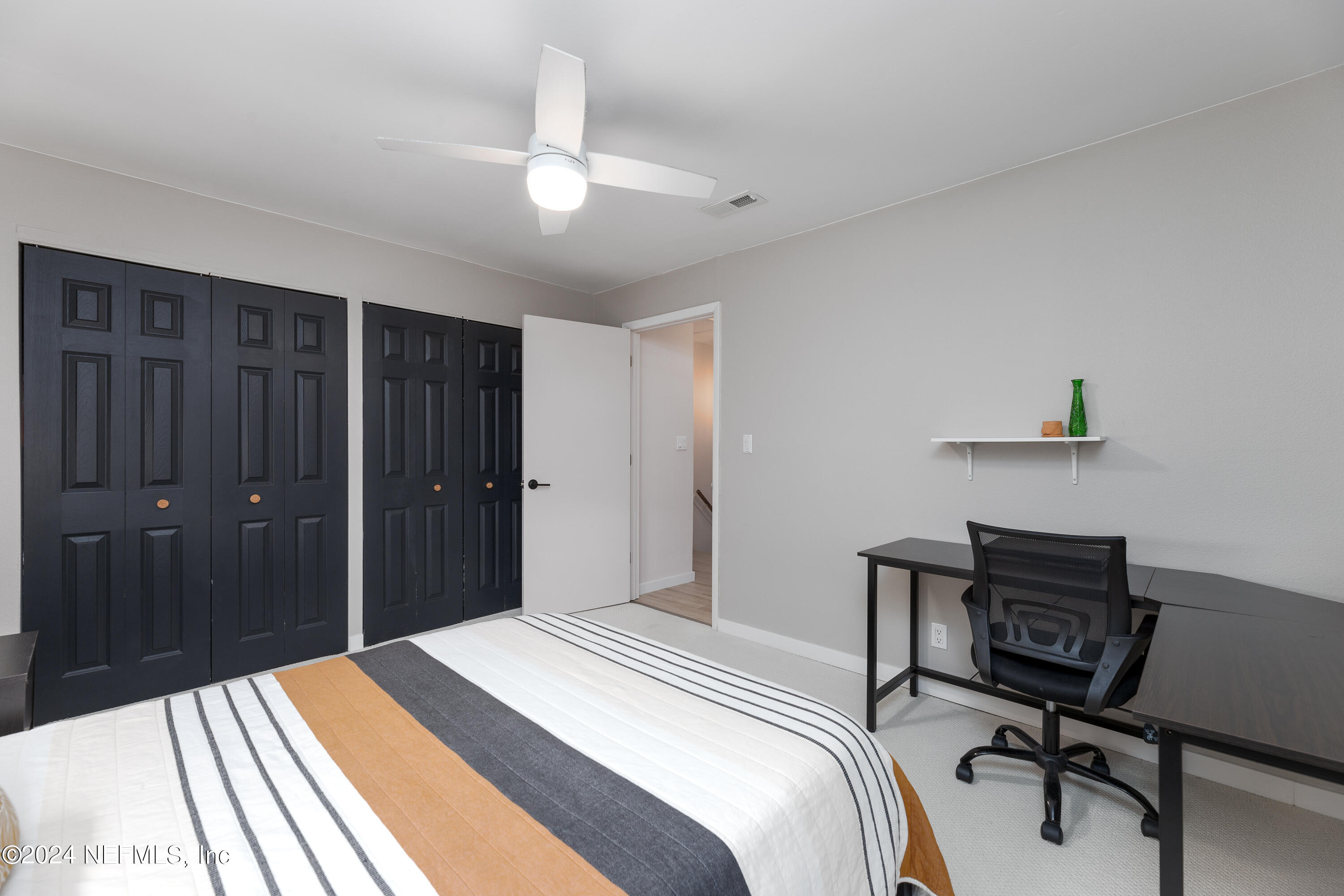 824 Cavalla Road Atlantic Beach, FL 32233 - Photo 14 of 18 a bedroom with a bed and a desk