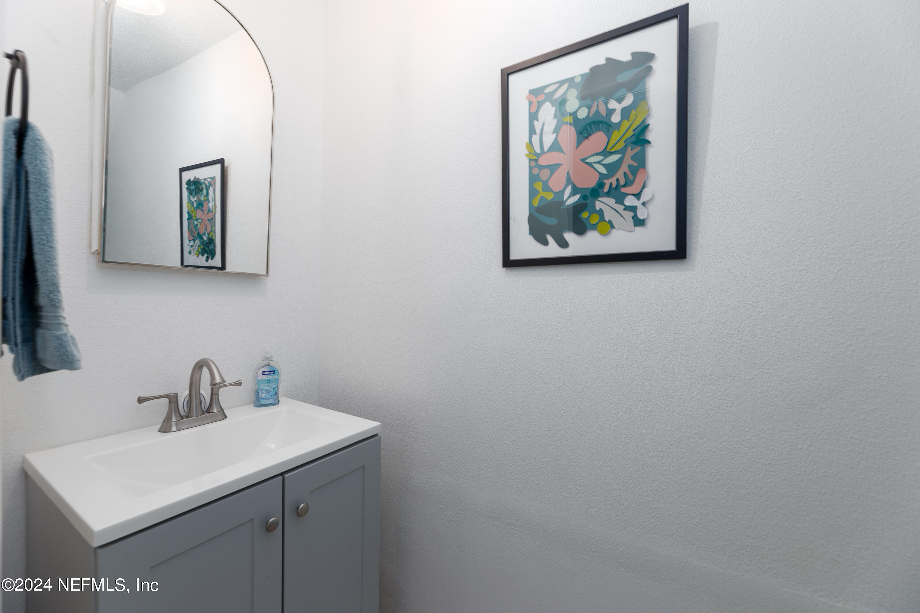 824 Cavalla Road Atlantic Beach, FL 32233 - Photo 18 of 18 a bathroom with a sink and a mirror