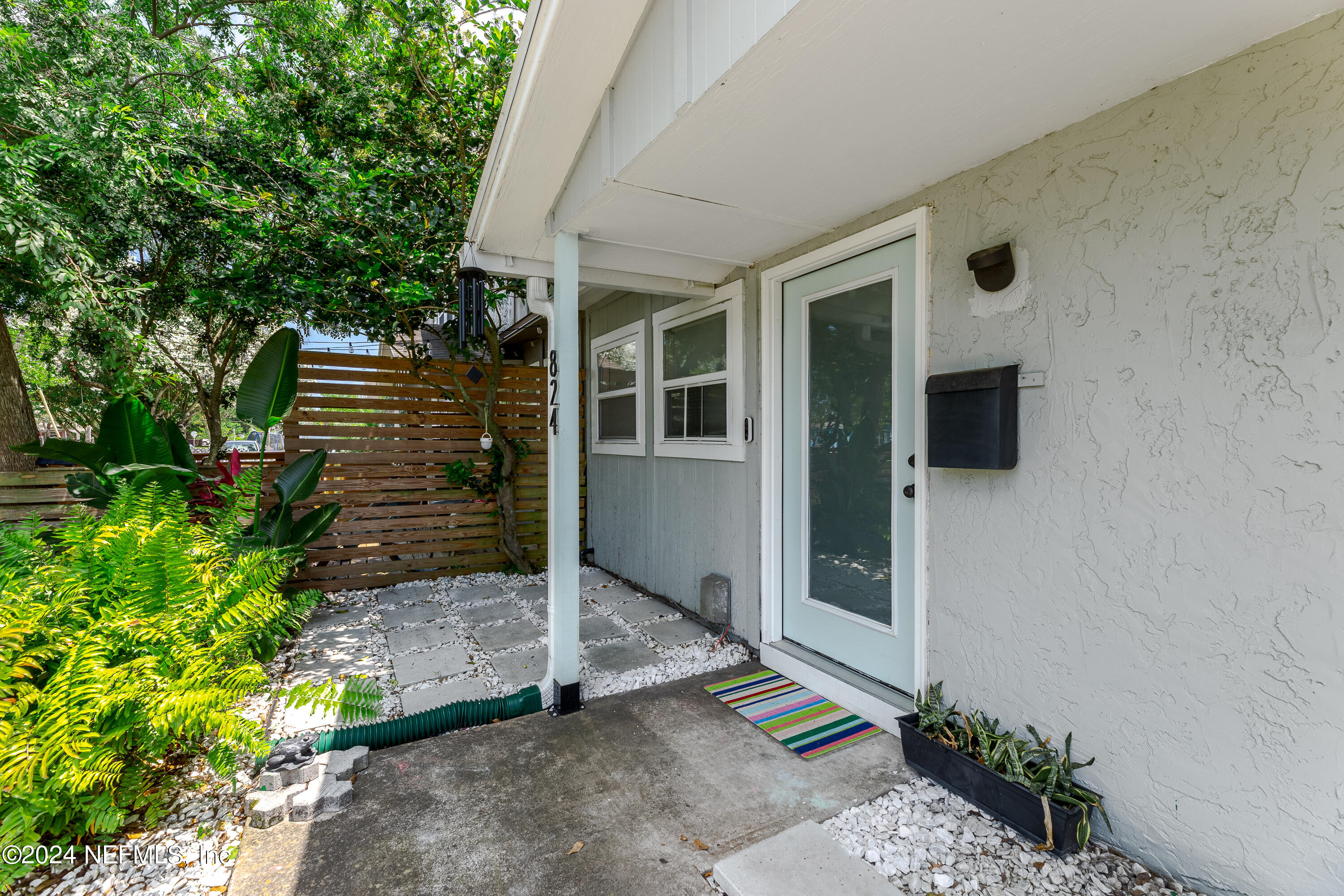 824 Cavalla Road Atlantic Beach, FL 32233 - Photo 2 of 18 a front view of a house with a yard