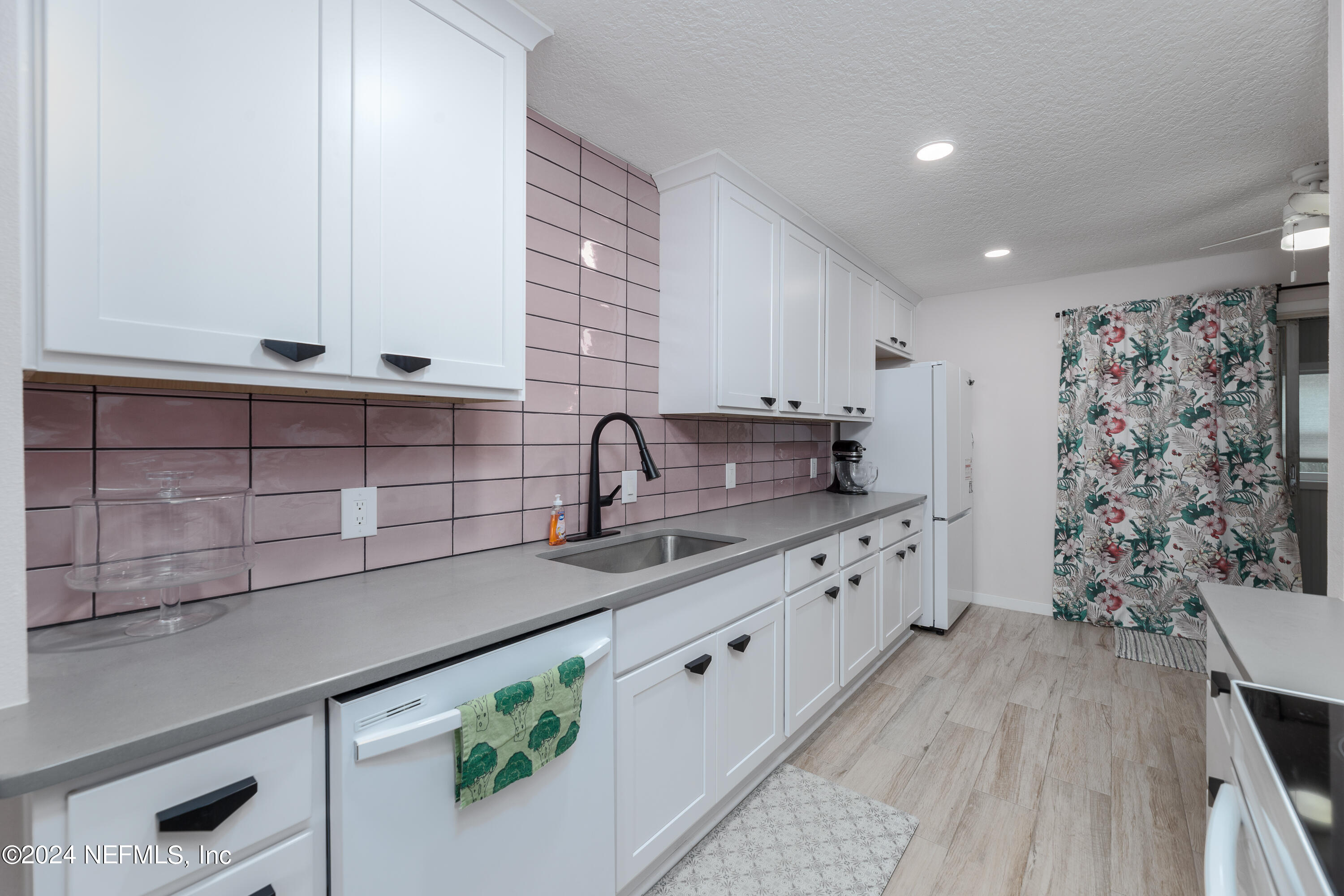 824 Cavalla Road Atlantic Beach, FL 32233 - Photo 6 of 18 a large kitchen with stainless steel appliances a sink dishwasher and cabinets