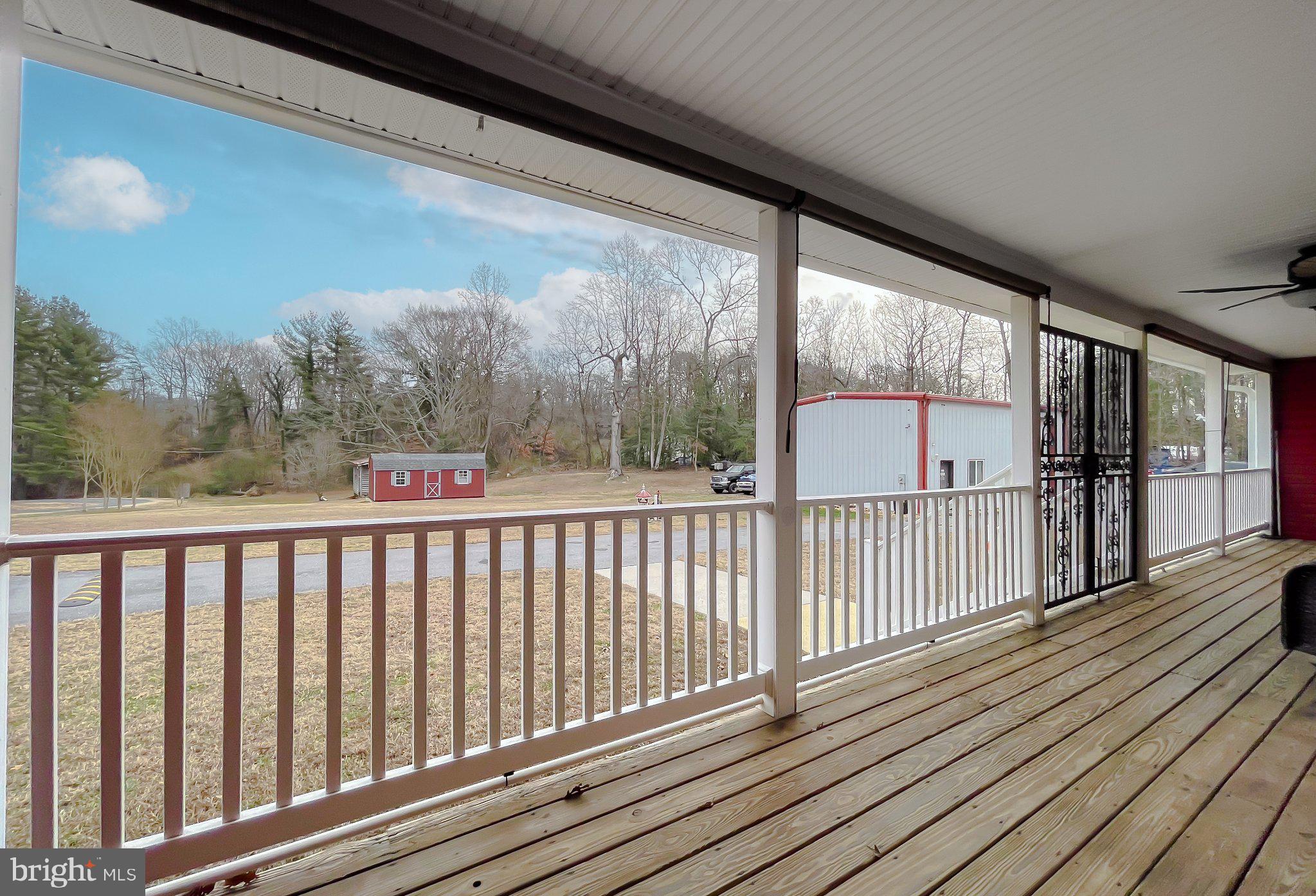 400 Adelina Road Prince Frederick, MD 20678 - Photo 41 of 57 Spacious porch with serene views.