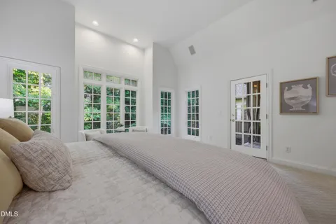 a view of staircase with railing and a rug