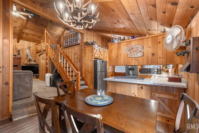a dining room with furniture and wooden floor