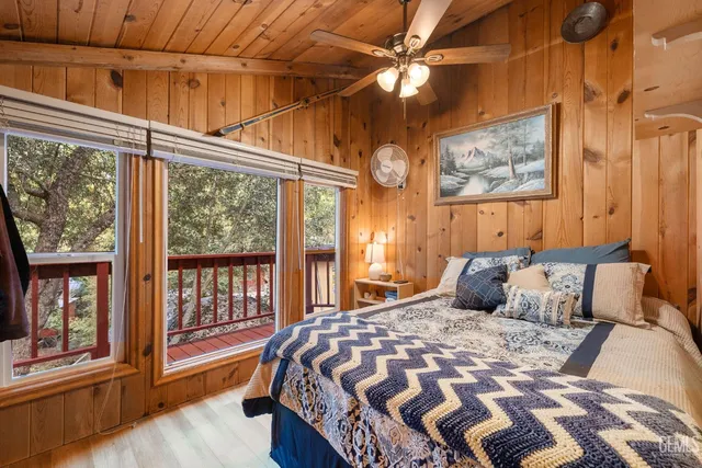 a bedroom with a large bed and a window