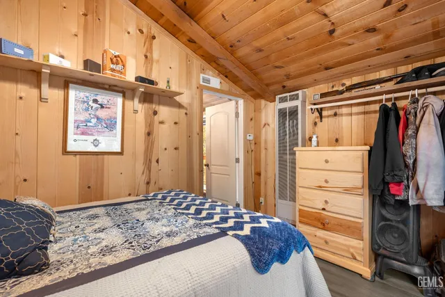 a bedroom with a bed and a walk in closet