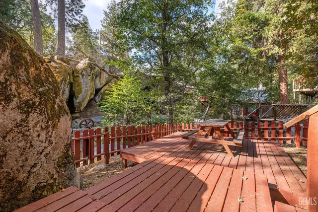 a view of balcony with wooden floor and outdoor seating