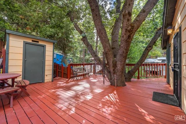 a balcony with trees in front of it