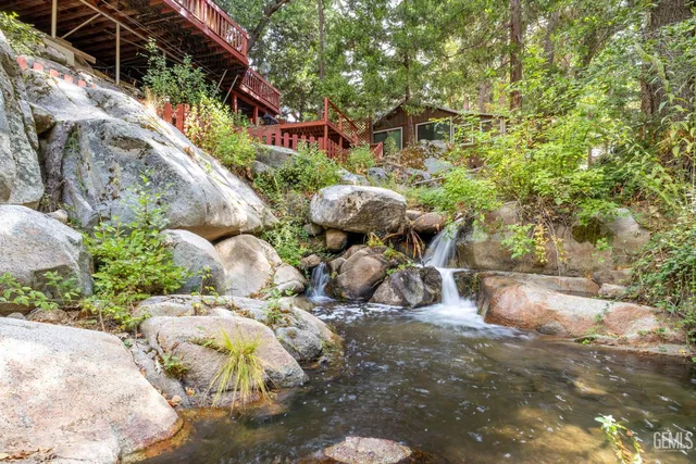a backyard of a house with lots of green space