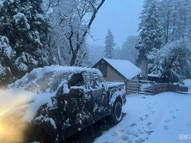 a view of a backyard of the house