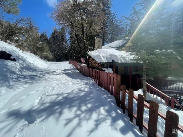 a view of a balcony with wooden fence