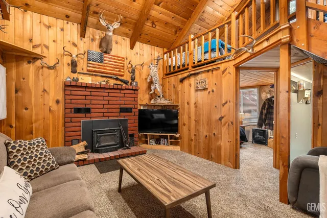 a outdoor living space with patio furniture and a fireplace