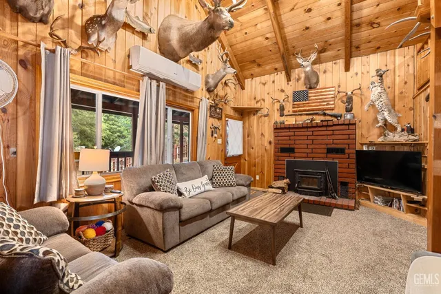 a living room with patio a couch and a flat screen tv