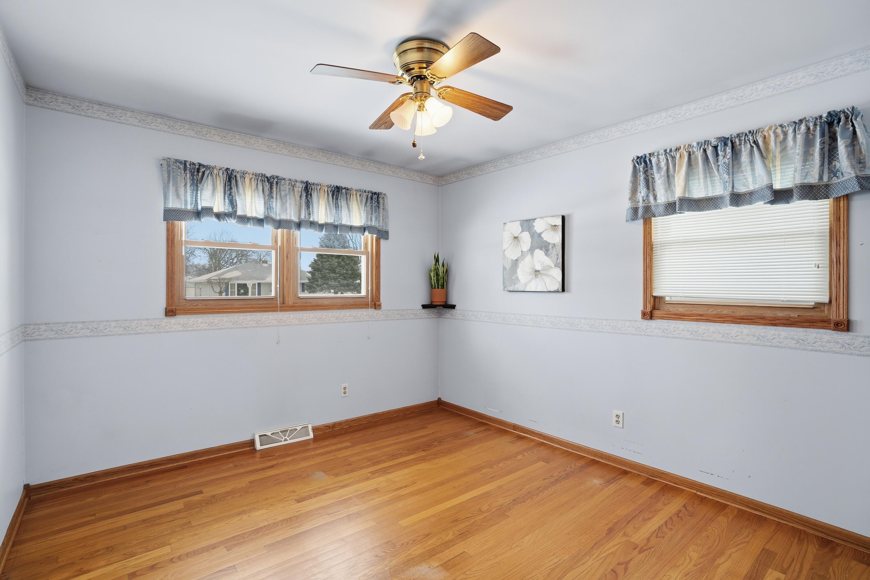 3514 41st Place Highland, IN 46322 - Photo 14 of 26 a view of an empty room with window and a chandelier fan