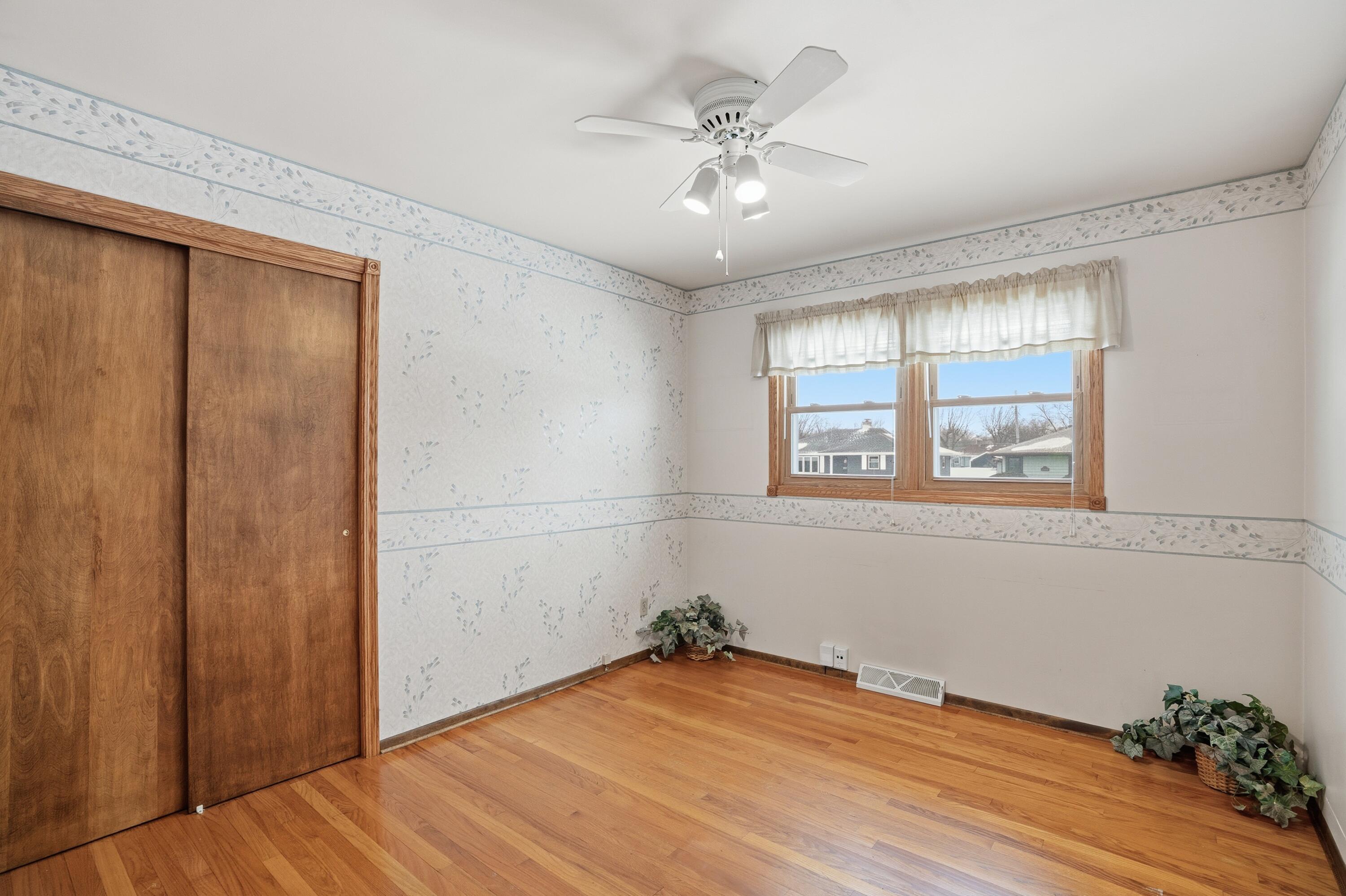 3514 41st Place Highland, IN 46322 - Photo 15 of 26 wooden floor in an empty room with a window