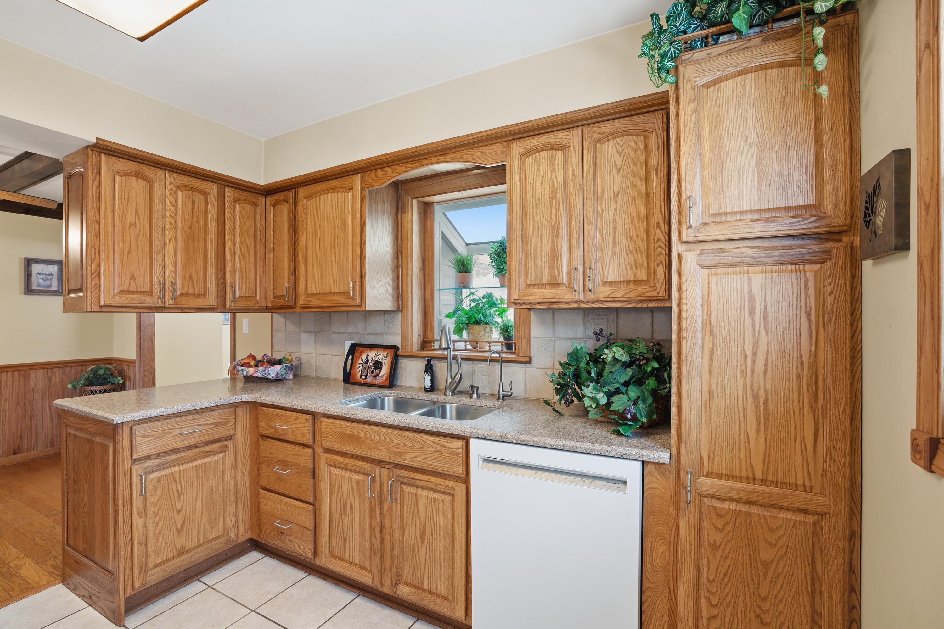 3514 41st Place Highland, IN 46322 - Photo 6 of 26 a kitchen with white cabinets and a refrigerator